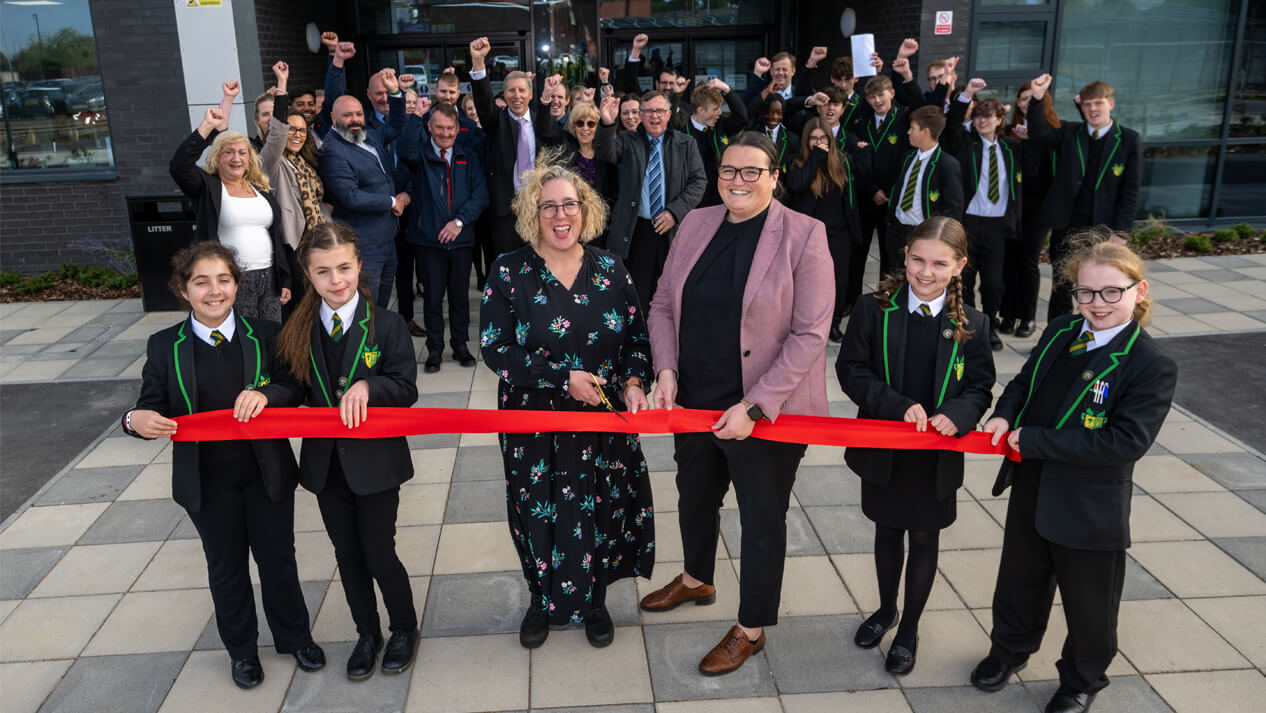 Cutting the ribbon at new Houstone Secondary School